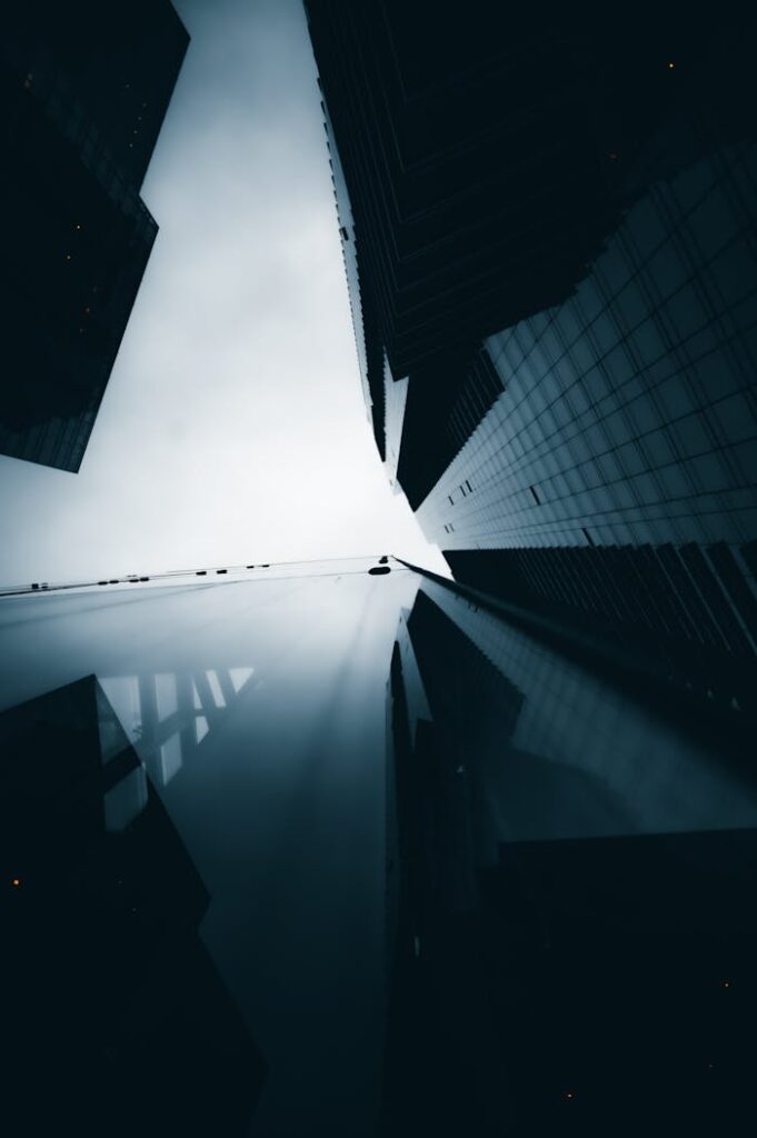 Dramatic low-angle view of towering skyscrapers against the sky.